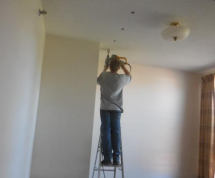 Technician installing insulation