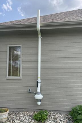 Radon Mitigation System On Home Exterior