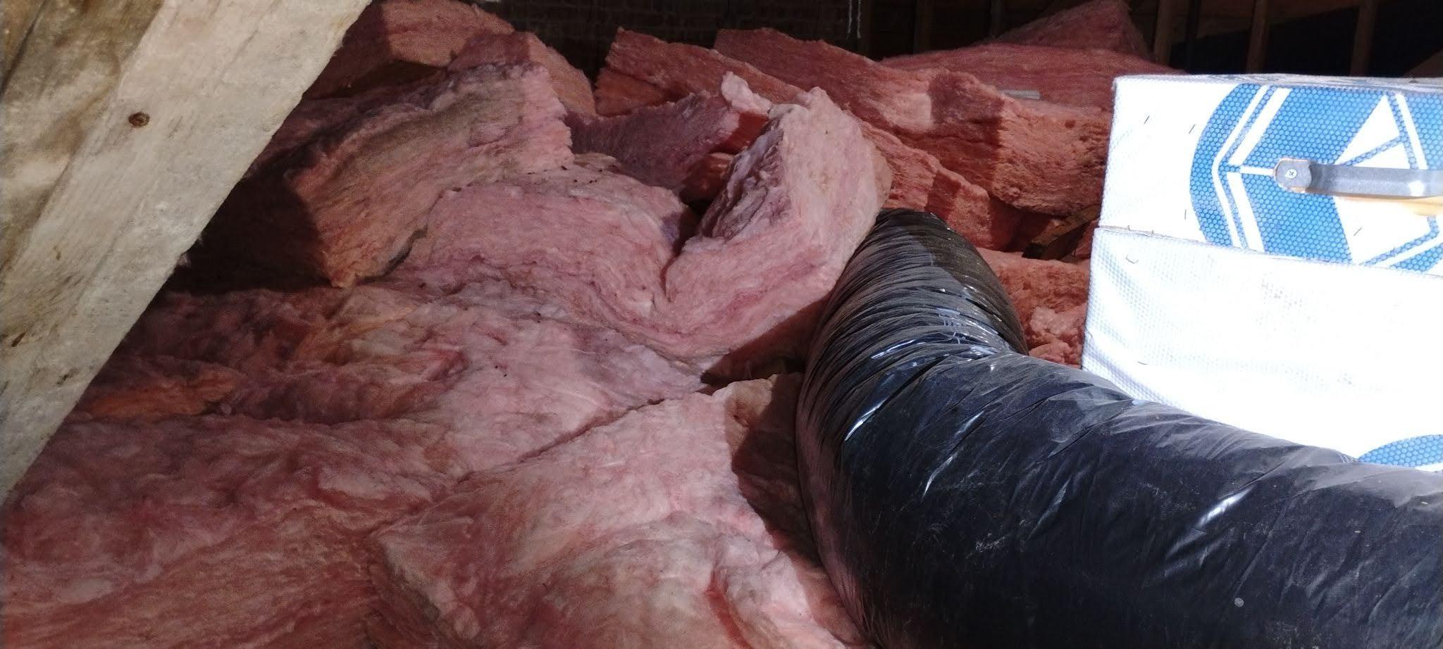 Poorly installed fiberglass batts in attic