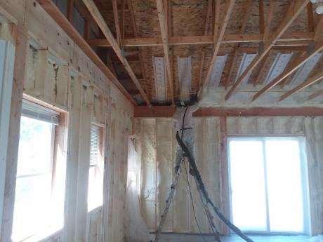 Accurate-Airtight Exteriors Crew Member Applying Spray Foam Insulation