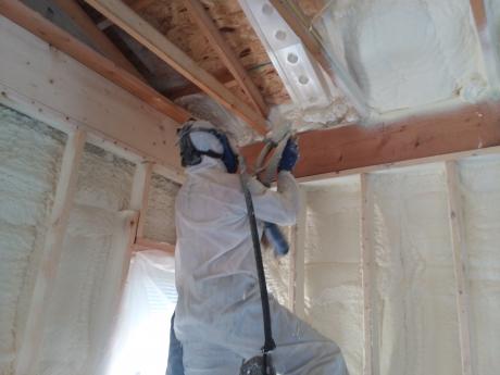 Accurate-Airtight Exteriors Crew Member Installing Spray Foam Insulation